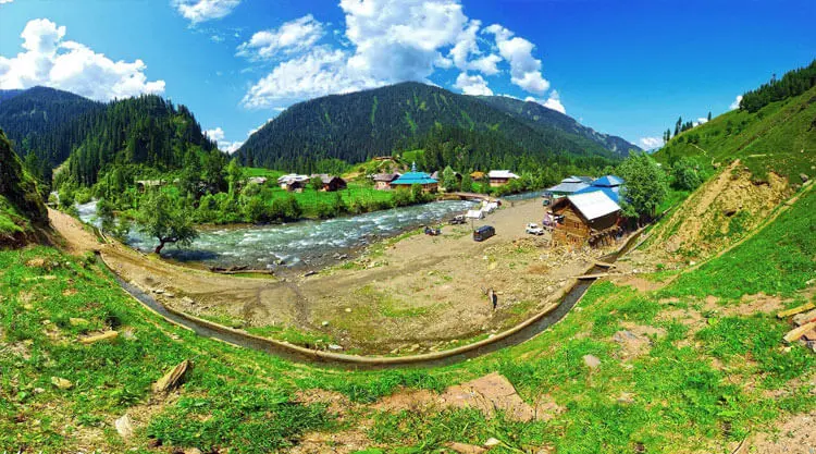 Lush green meadows and snow peaks in Gulmarg Kashmir thumbnail